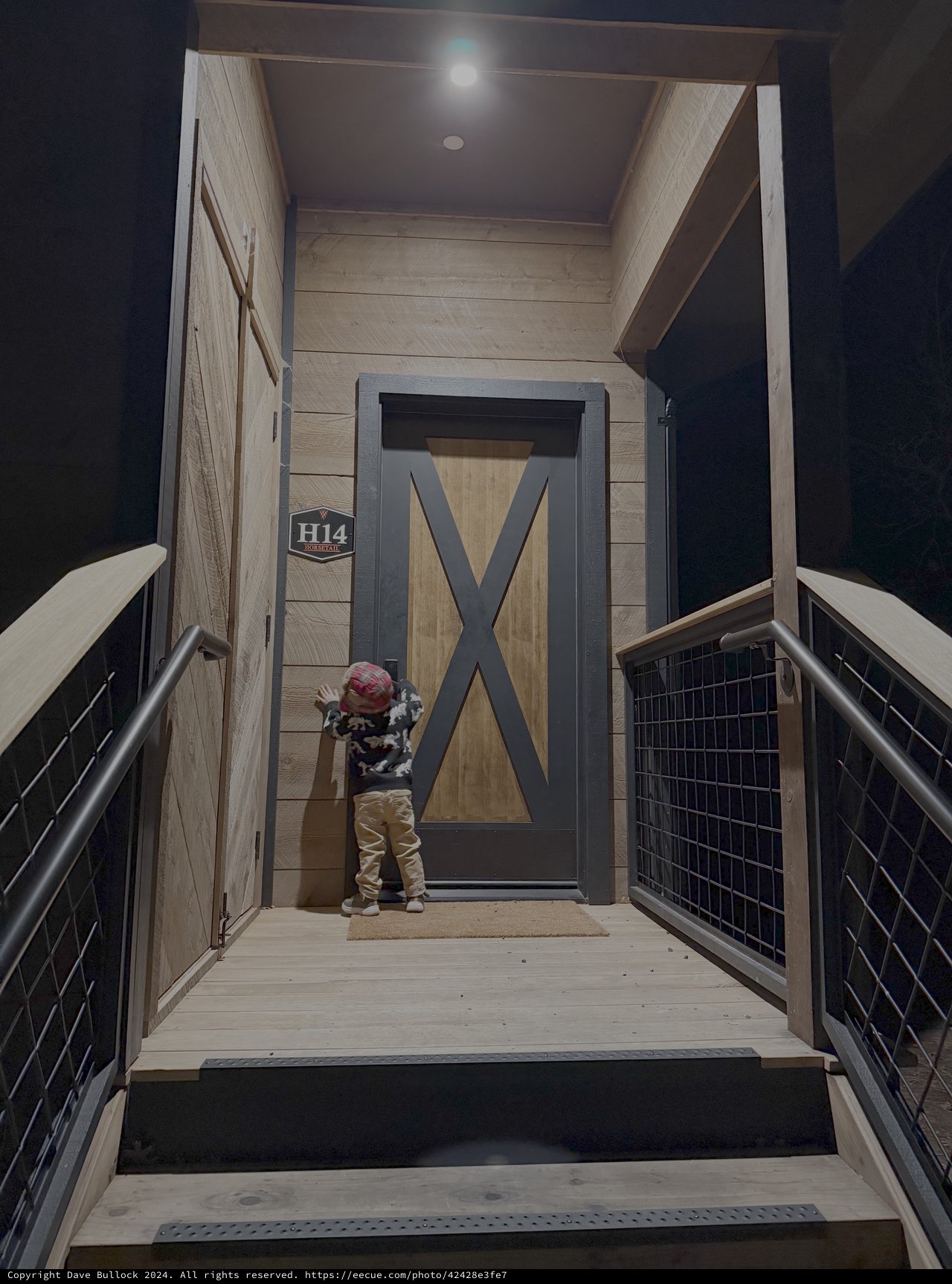 Child at Modern Apartment Door with X Design