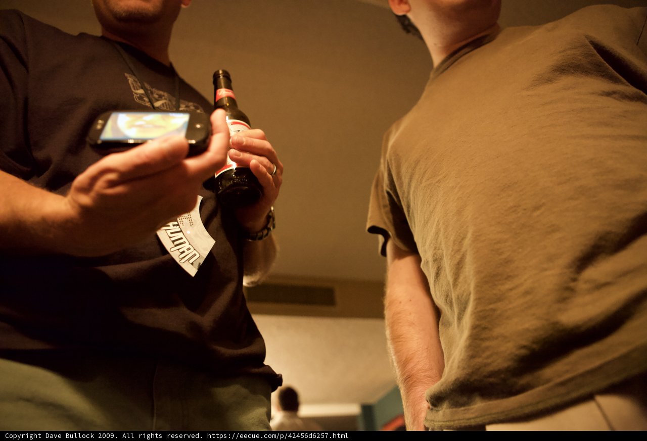 Two Men Engrossed in Technology