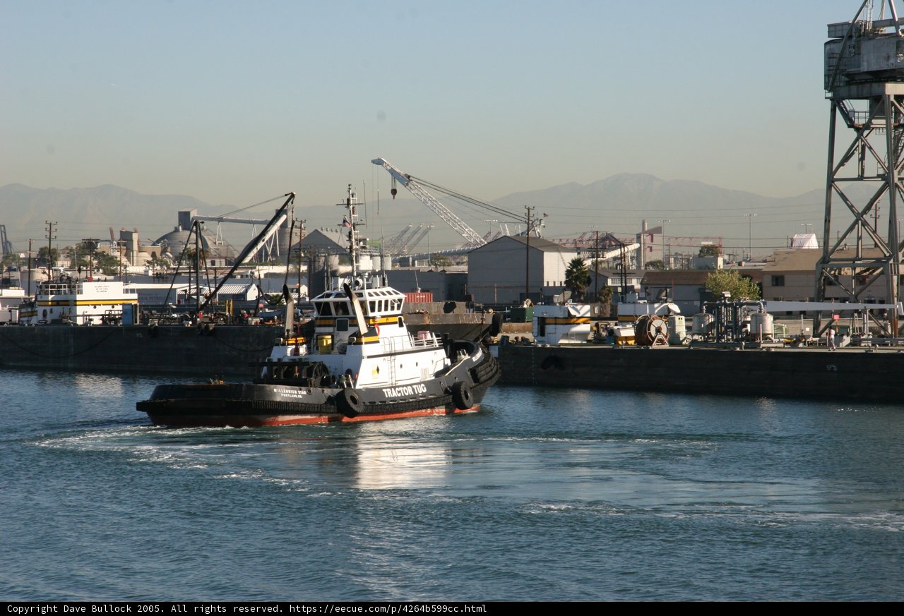 Tugboat Guiding Barge at the Port
