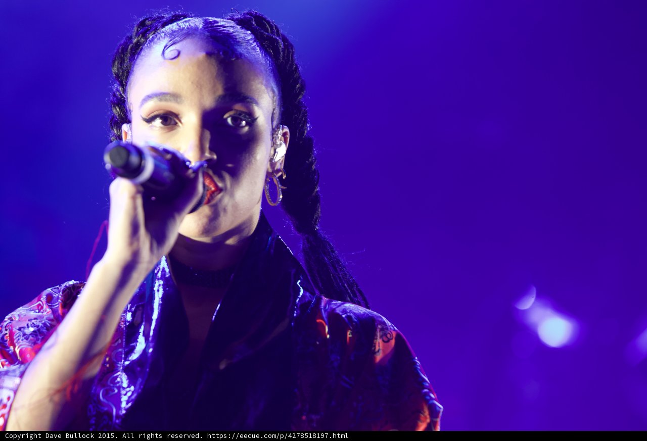 FKA twigs Portrait Face Visible Baby Hairs Swirls Cat-Eye Makeup Hoop Earrings Red Lipstick Braided Ponytails Black Choker Kimono Red Gold Patterns Purple Blue Lighting Spotlight