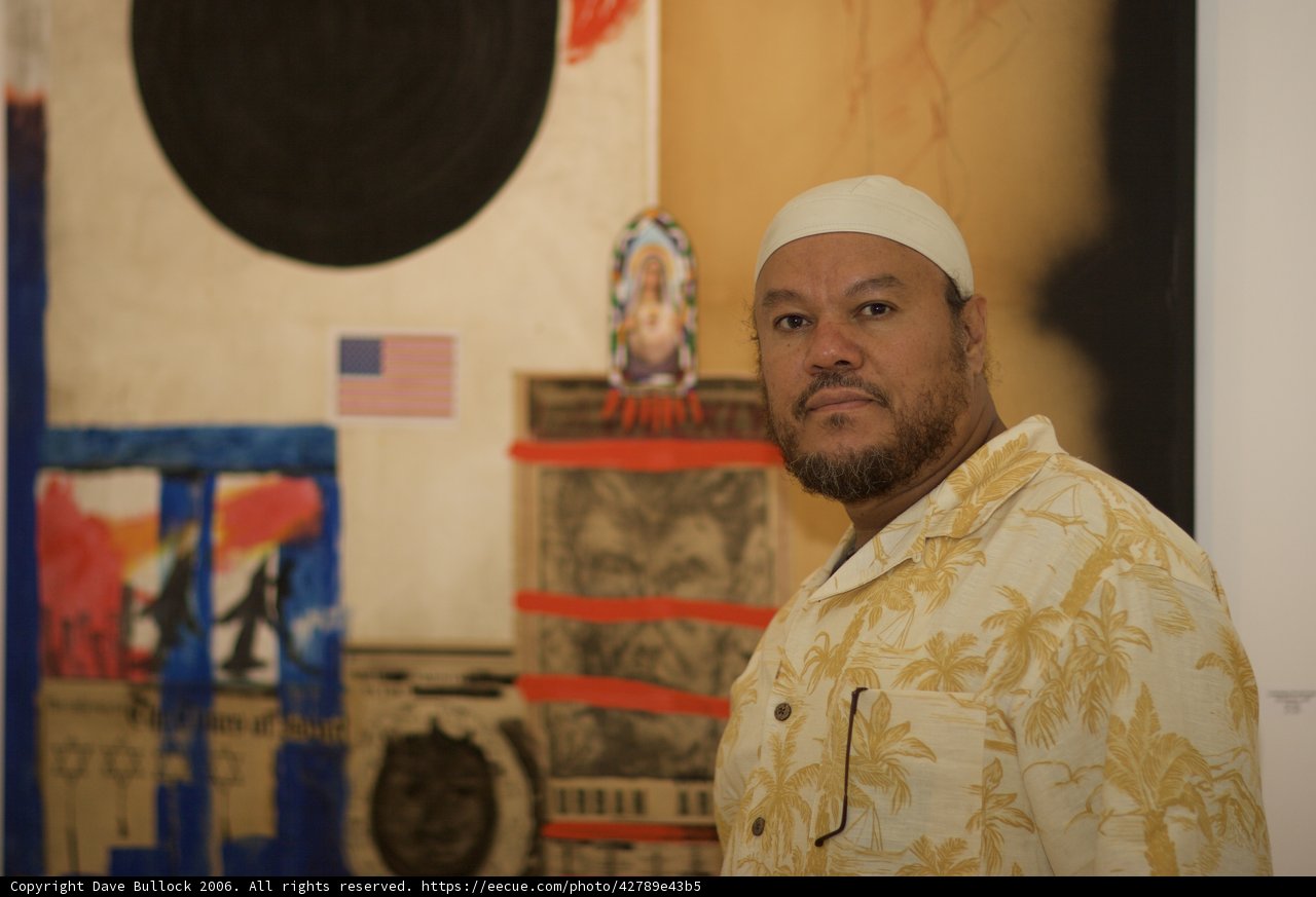 Man in White Hat Contemplates Painting