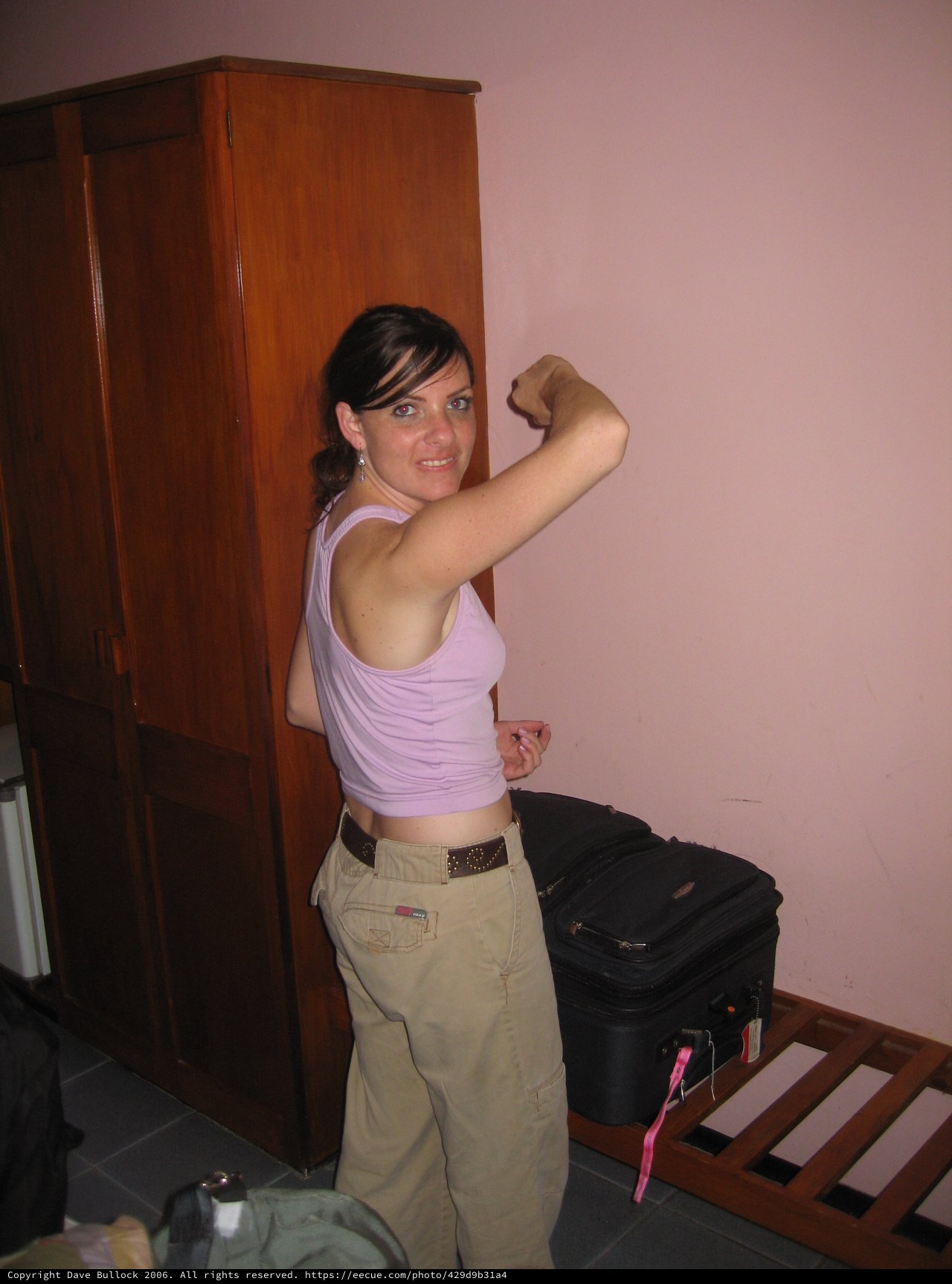 Traveler Flexing Muscles in Hotel Room Fiji