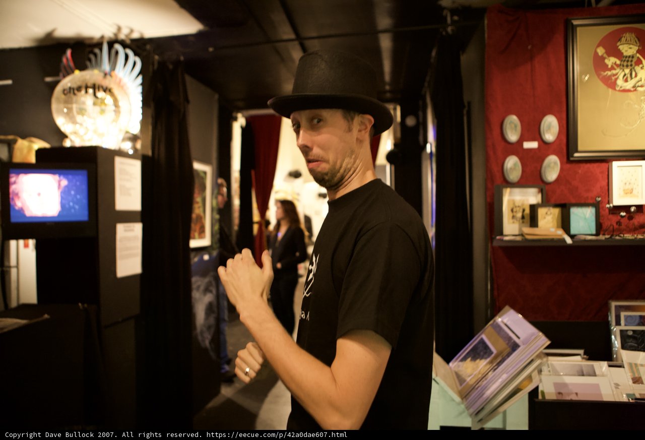 Man with TV-inspired Sign and Hat at 2007 Art Walk