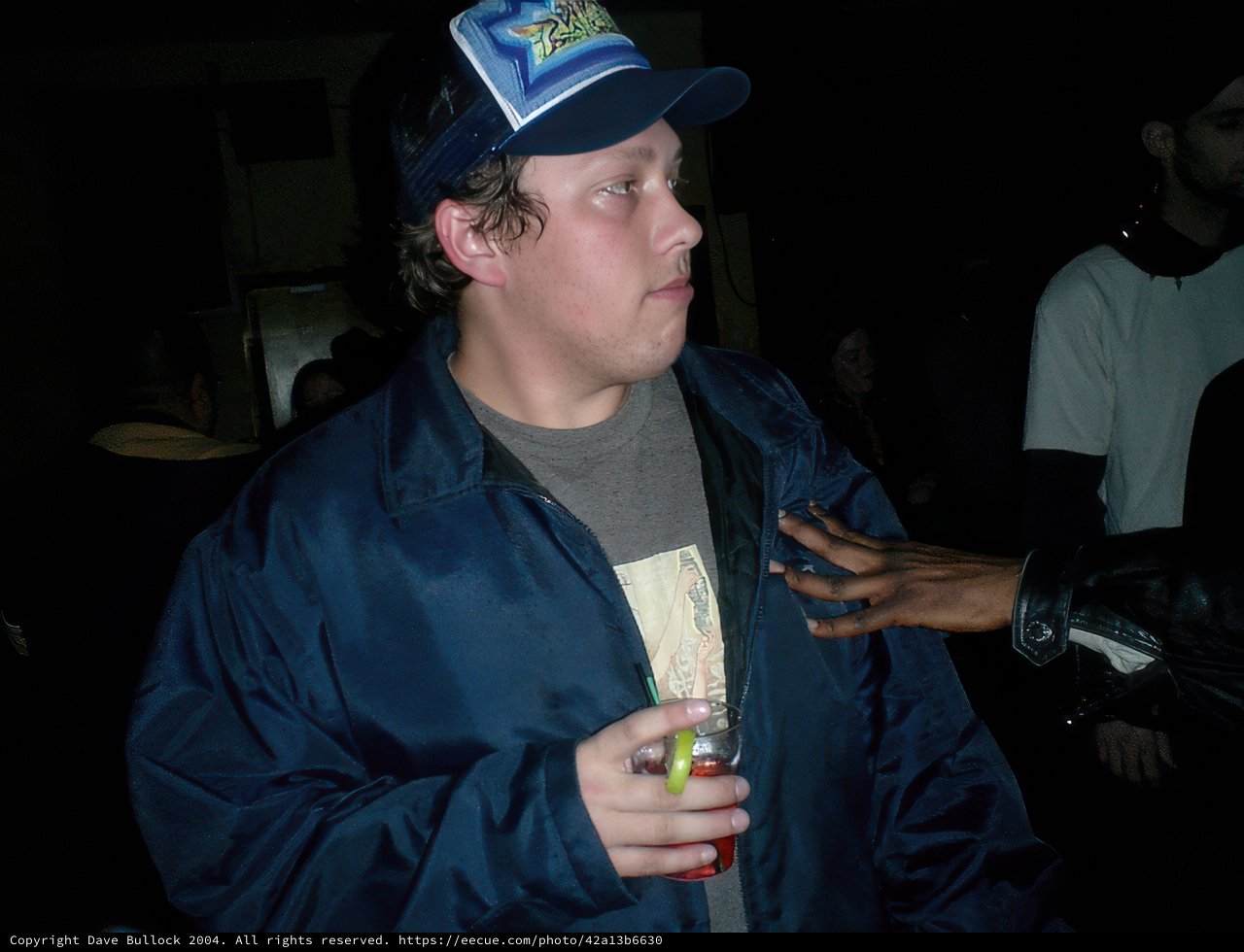 Cameron W Sports a Blue Jacket and Baseball Cap