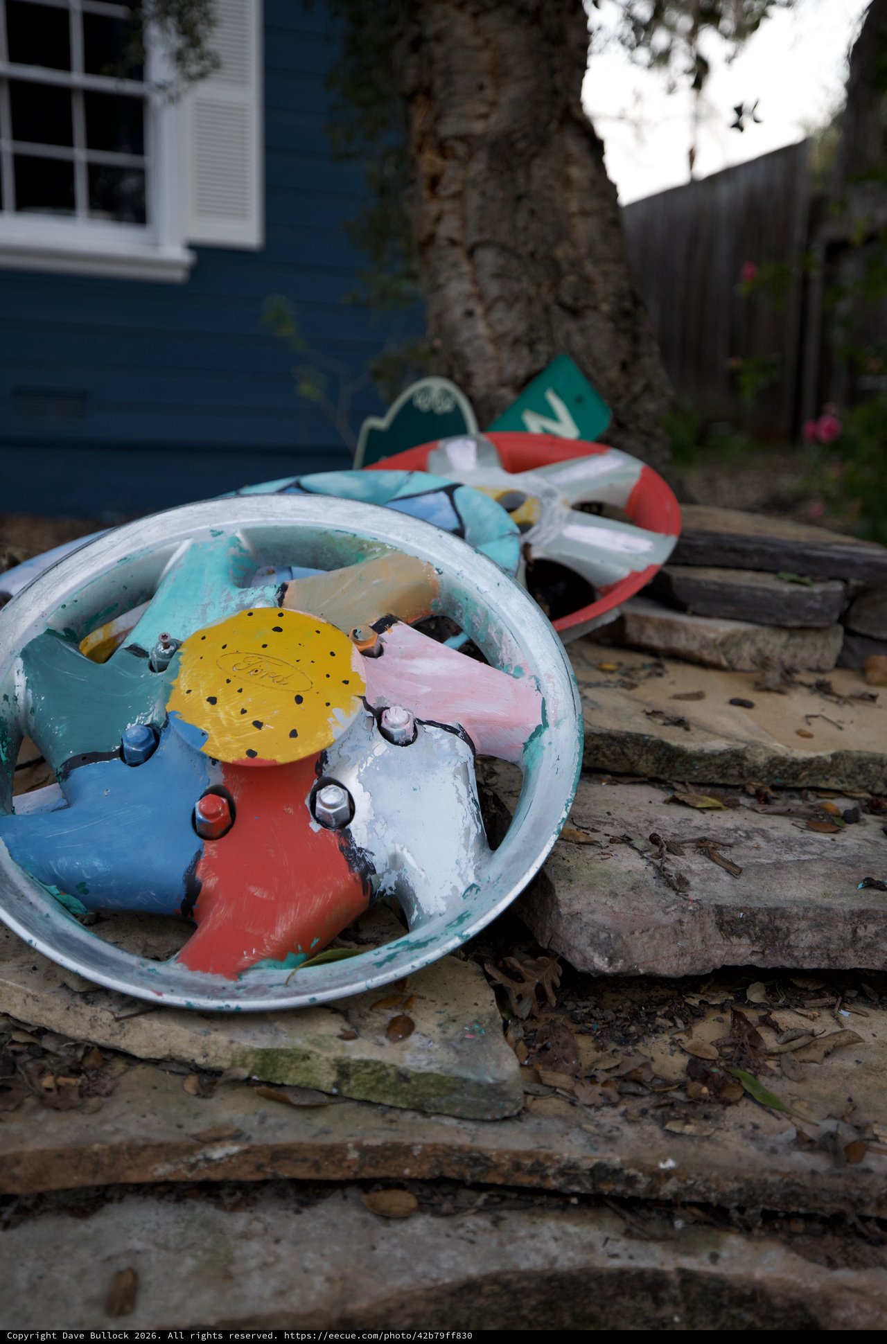 Broken Colorful Toy Clock in Backyard Garden