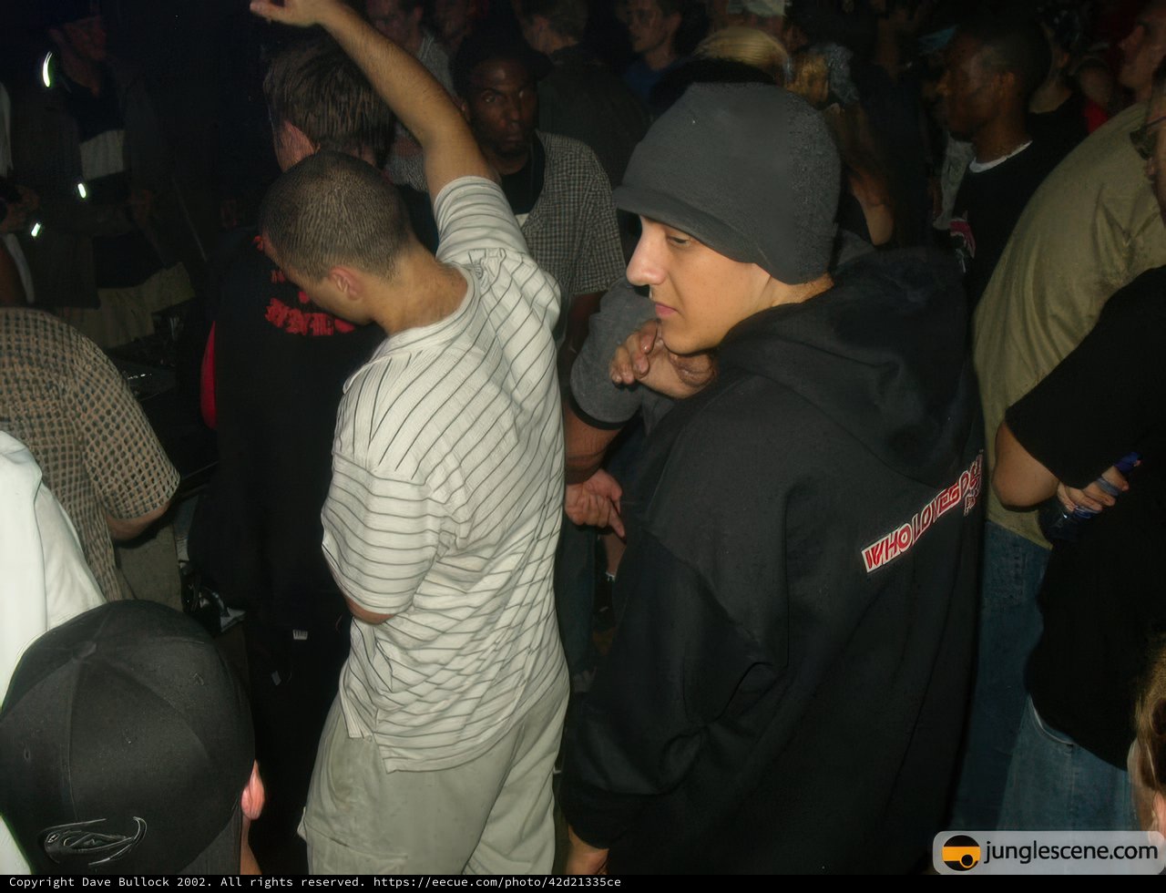 Nightclub crowd wearing hats and beanies