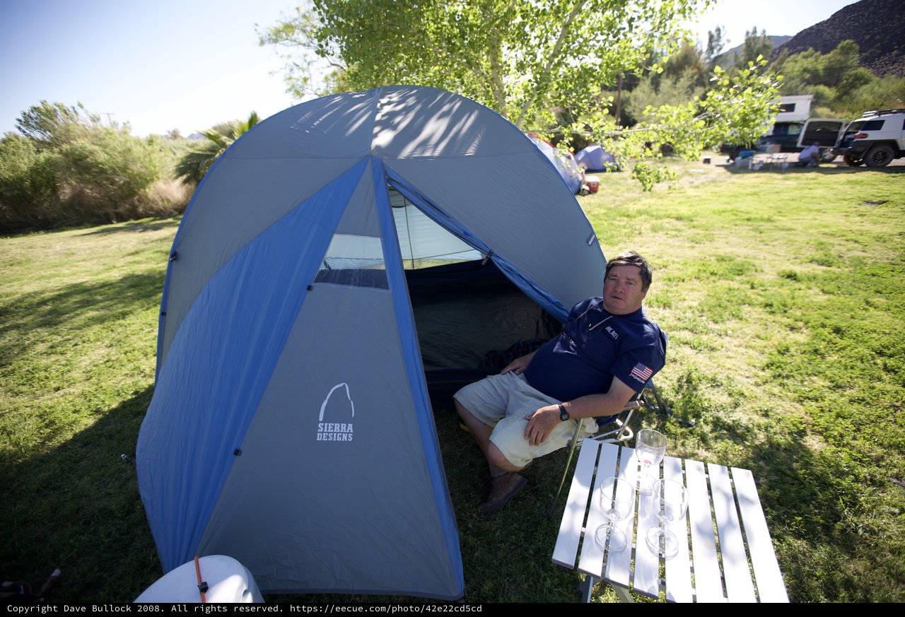 Relaxing Camper at Sierra Designs Tent Doorway