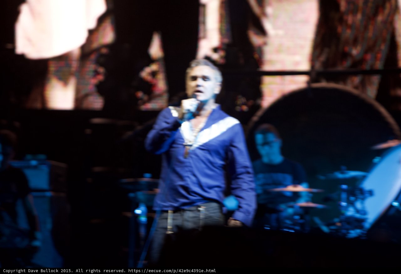 Morrissey Singing Blue Shirt Unbuttoned Necklaces Bassist Drummer Glasses Capitol Tee Gong Smiths Screen