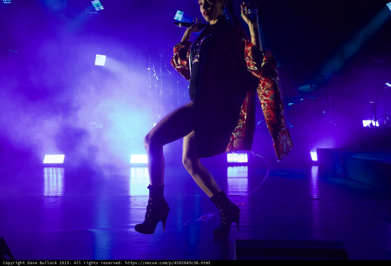 FKA twigs Dynamic Full Body Striding Arm Raised Expressive Hand Kimono Flowing Red Brocade Gold Chinese Patterns Black Bodysuit Boots LED Panels Haze