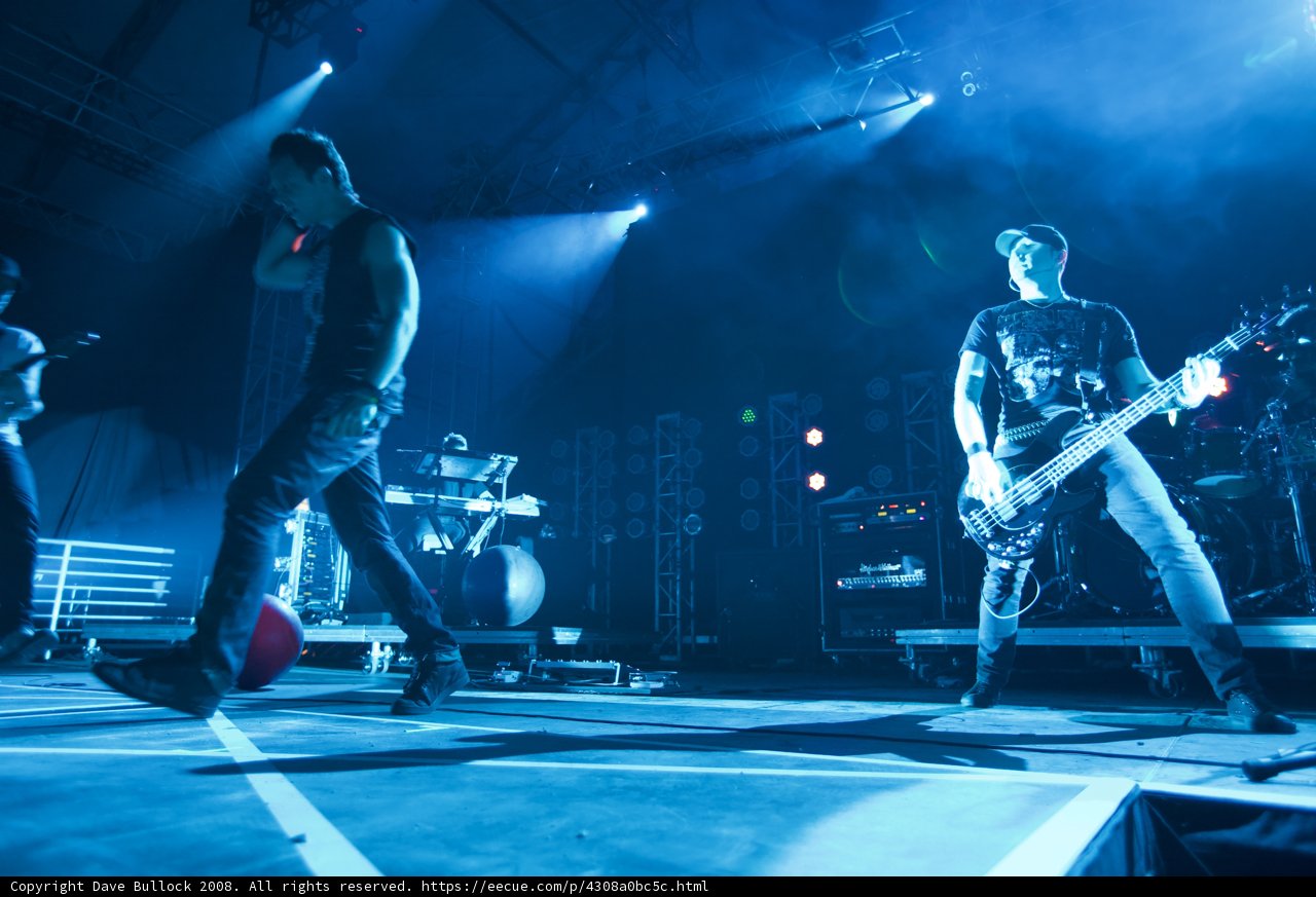 Live Performance with Blue Lighting and Guitar