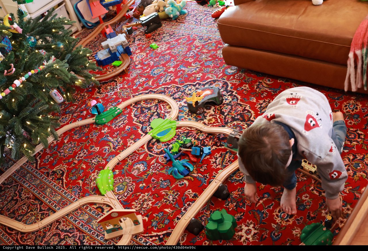 Child Playing with Train Set on Christmas Morning
