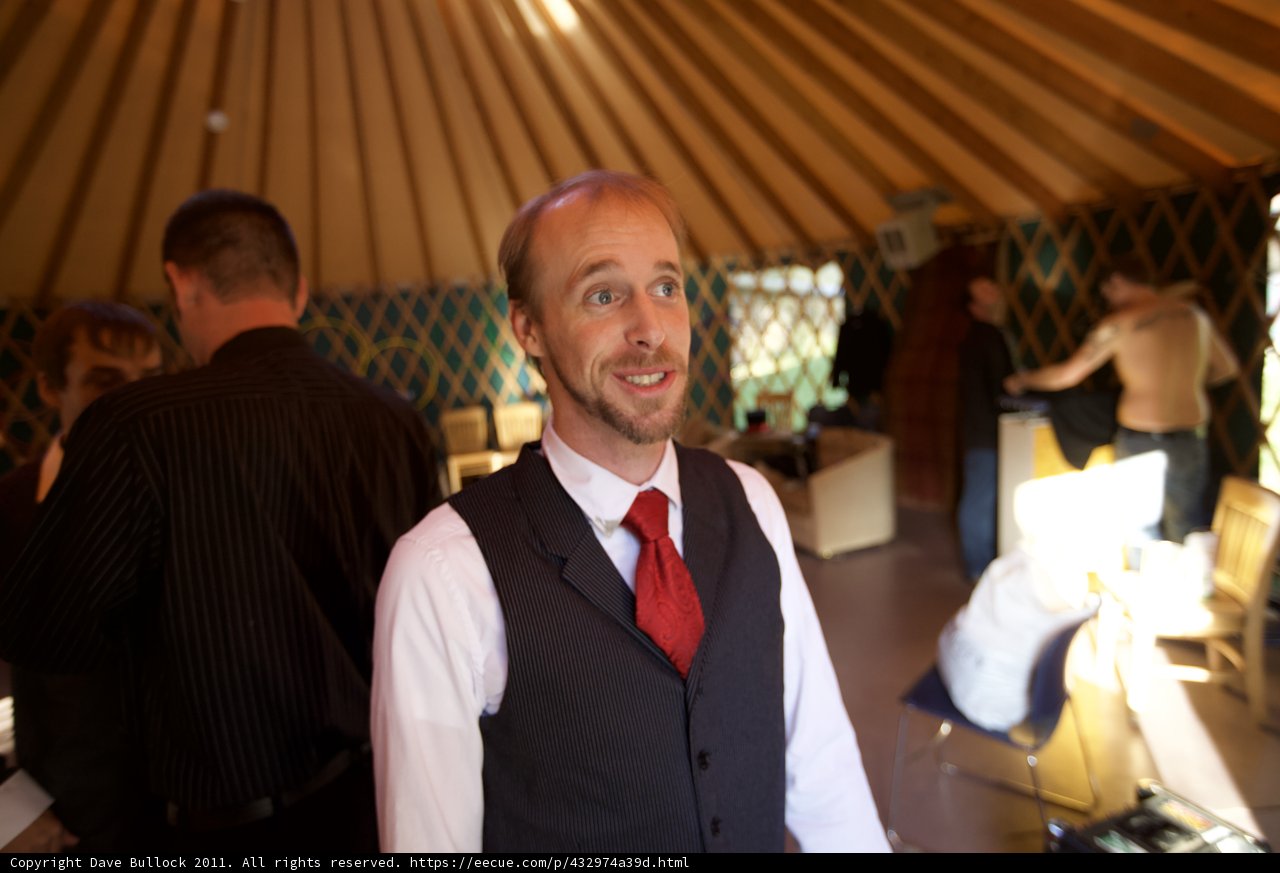 Formal Attire in a Plywood Room