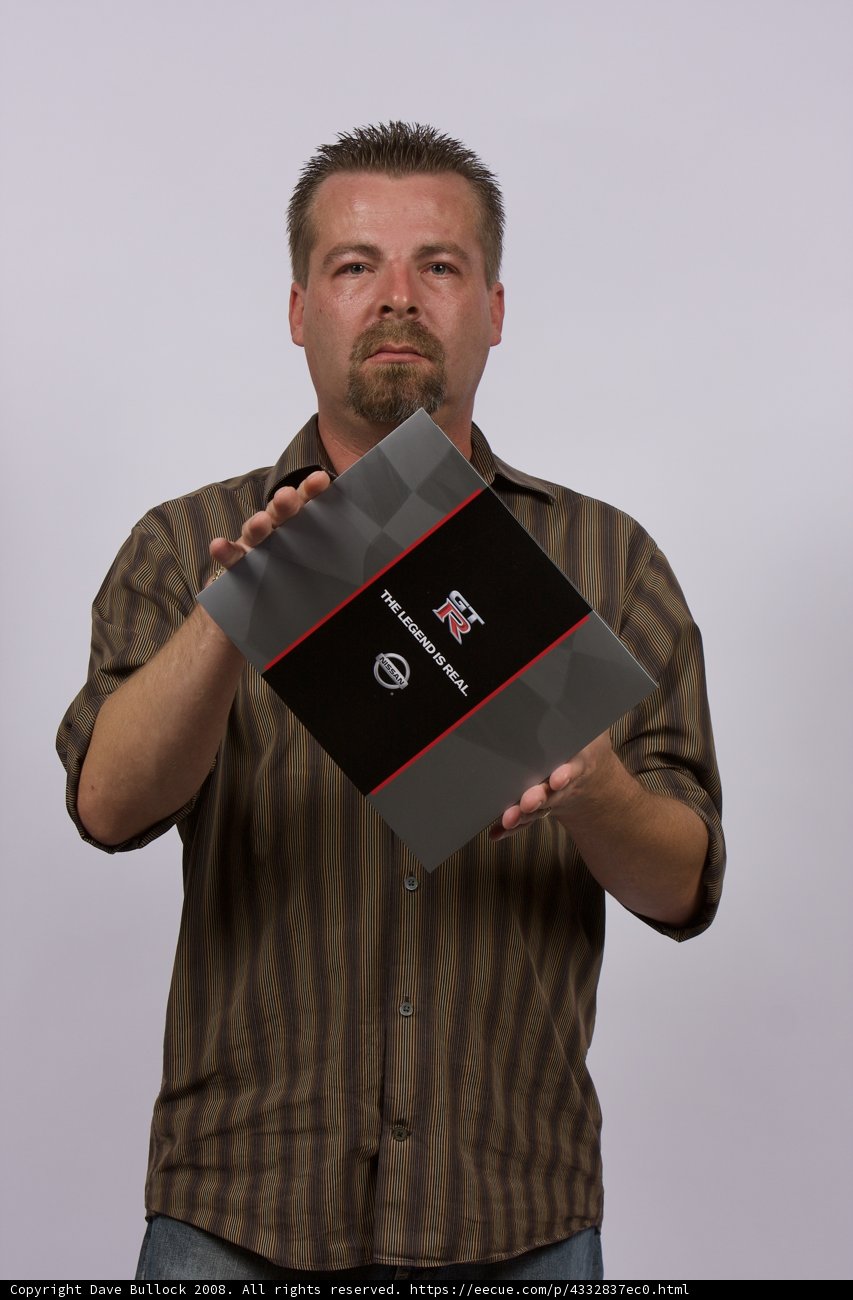 Red and Black Folder in Hand