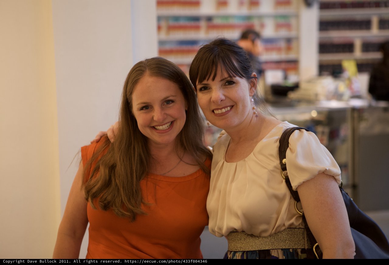 Two Women Smiling at a Wine Party Event