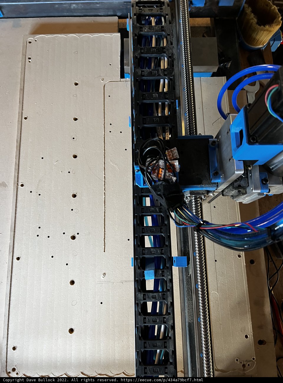 Automated machine working on a piece of cardboard