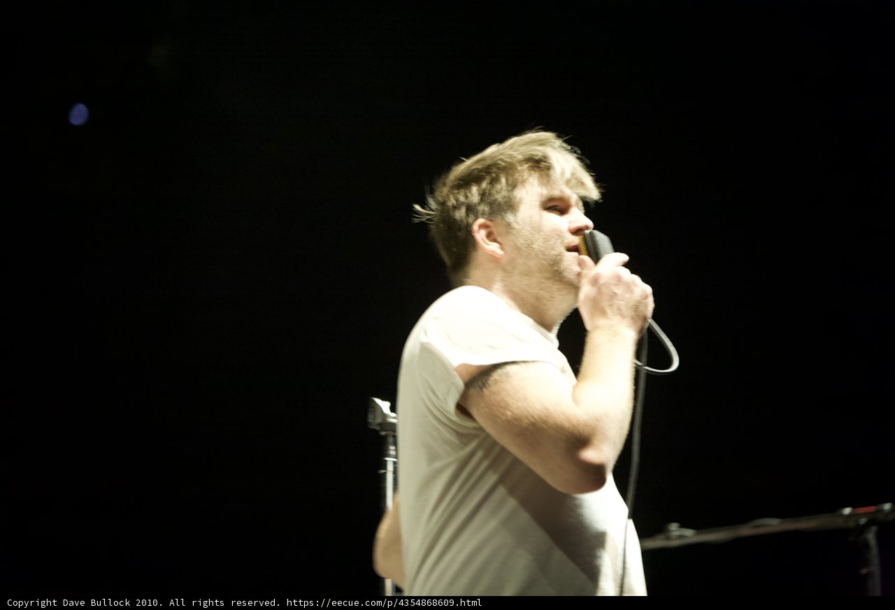 James Murphy performing with a Microphone
