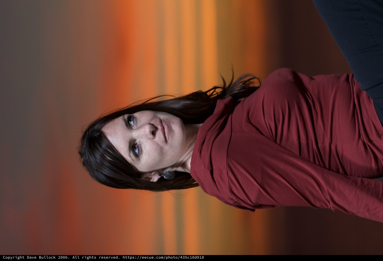 Woman Gazing Skyward Against a Fiery Sunset