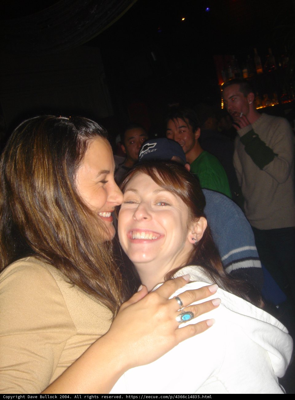 Women Embracing at Night Club