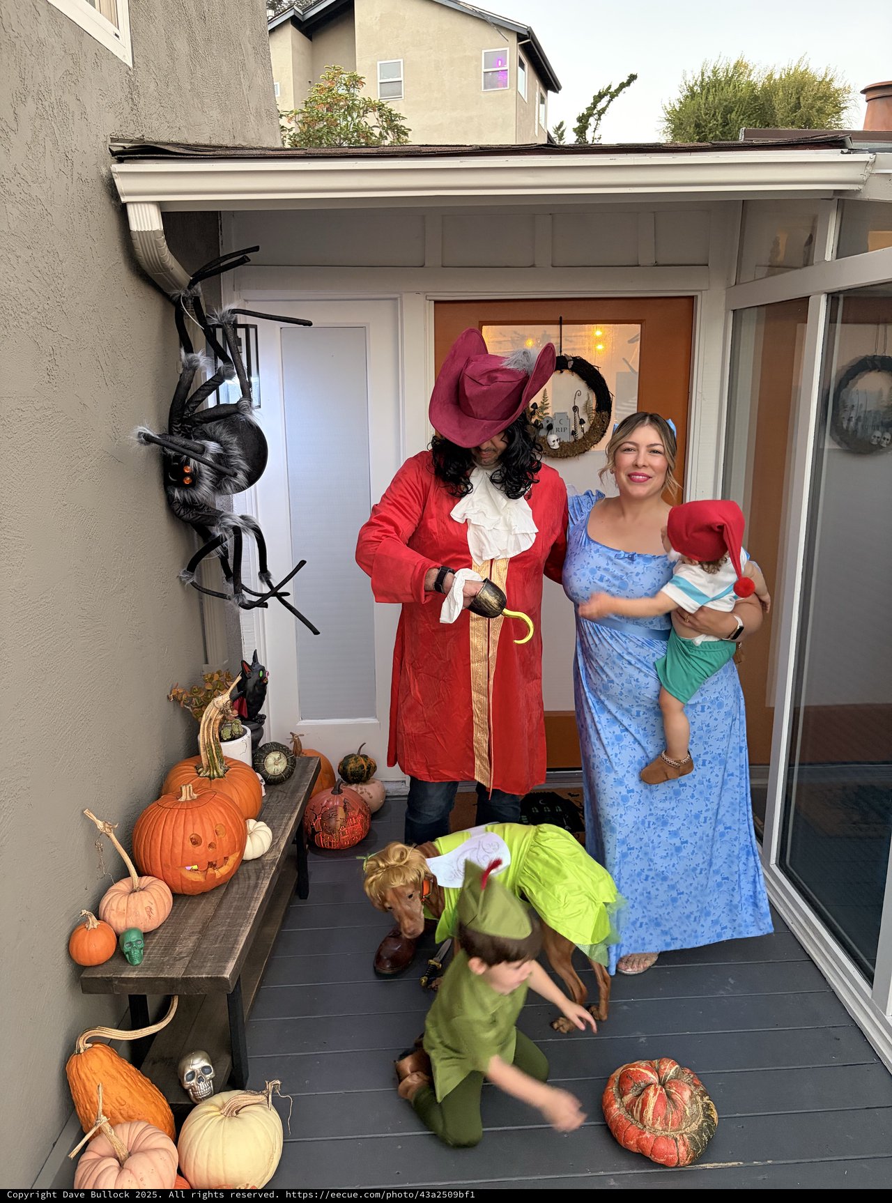 Family Peter Pan Halloween Costume on Decorated Porch