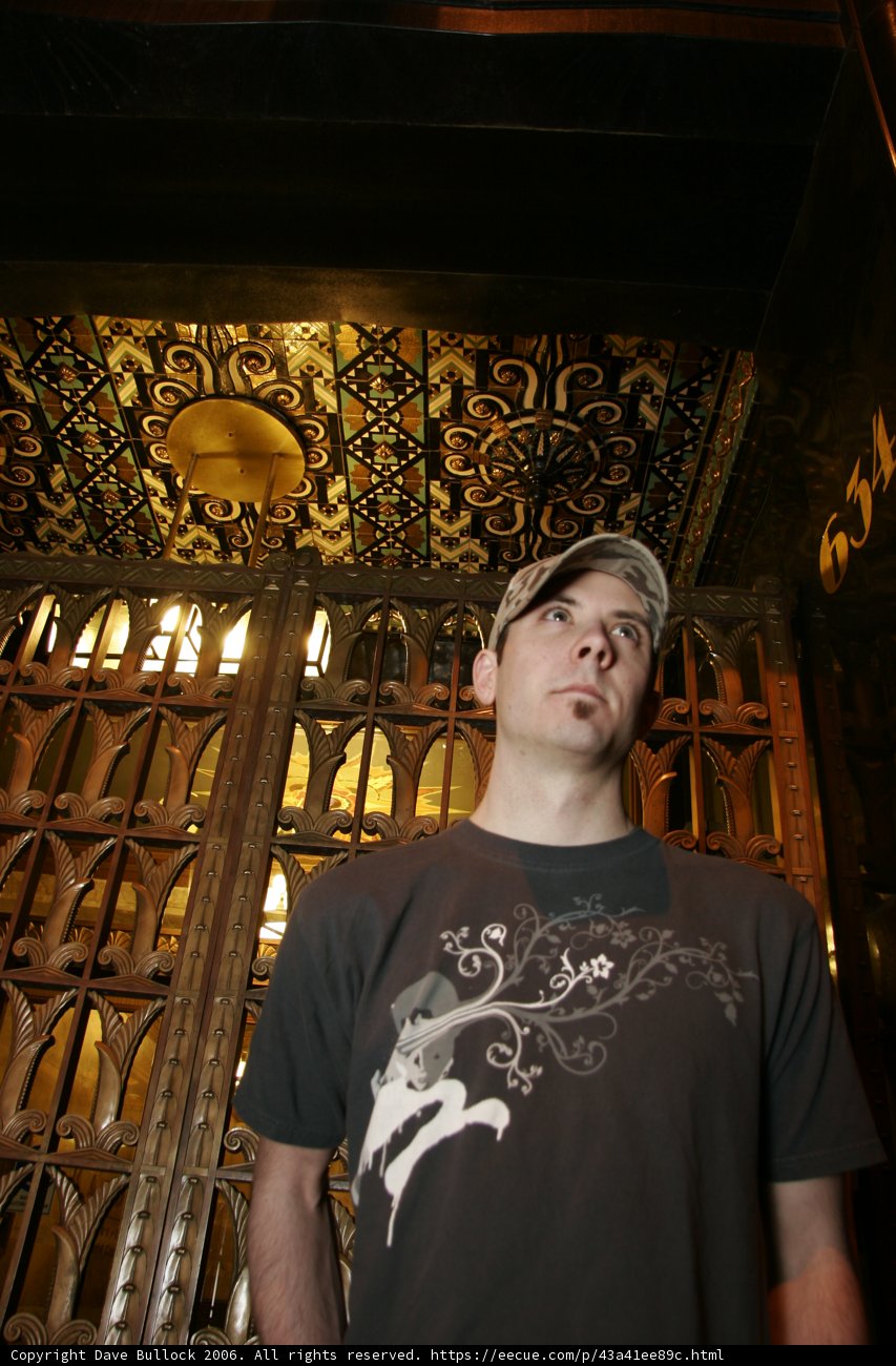 Hat-wearing man in a crypt
