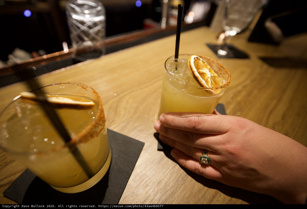 Margaritas with Dried Orange Garnish at Bar