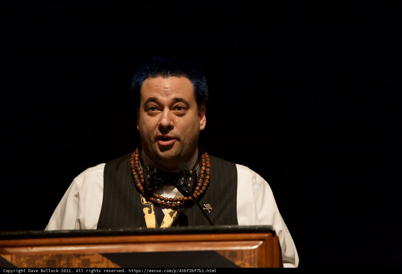 Blue-haired Man giving a Speech