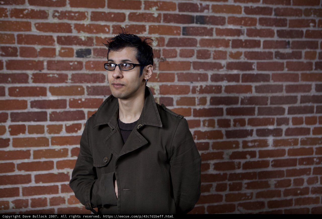 The Smiling Man in the Brick Wall