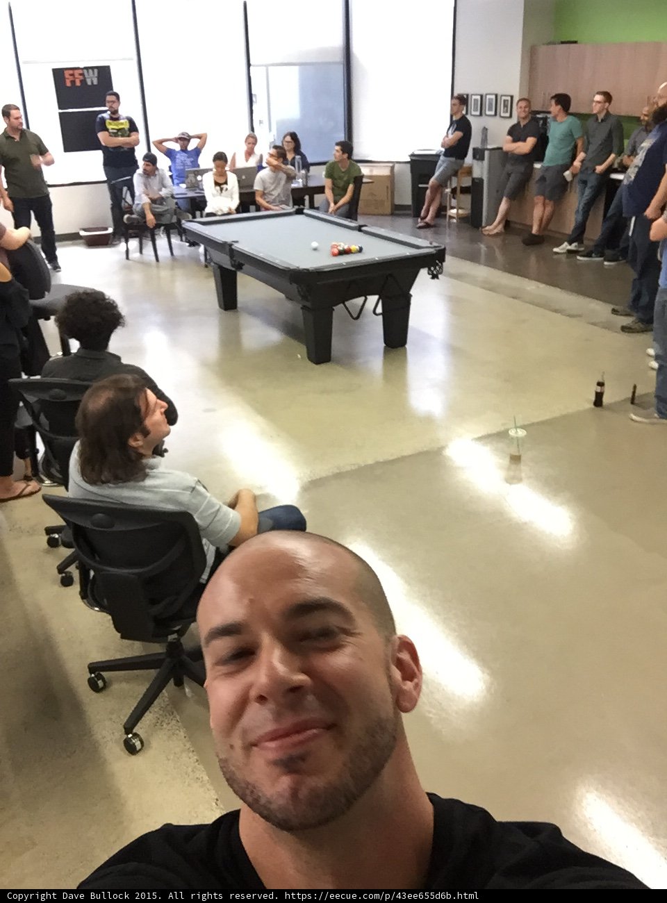 FFW Office All Hands Meeting Selfie Pool Table Employees Gathered Tech Startup Interior Modern Open Floor Plan Smiling