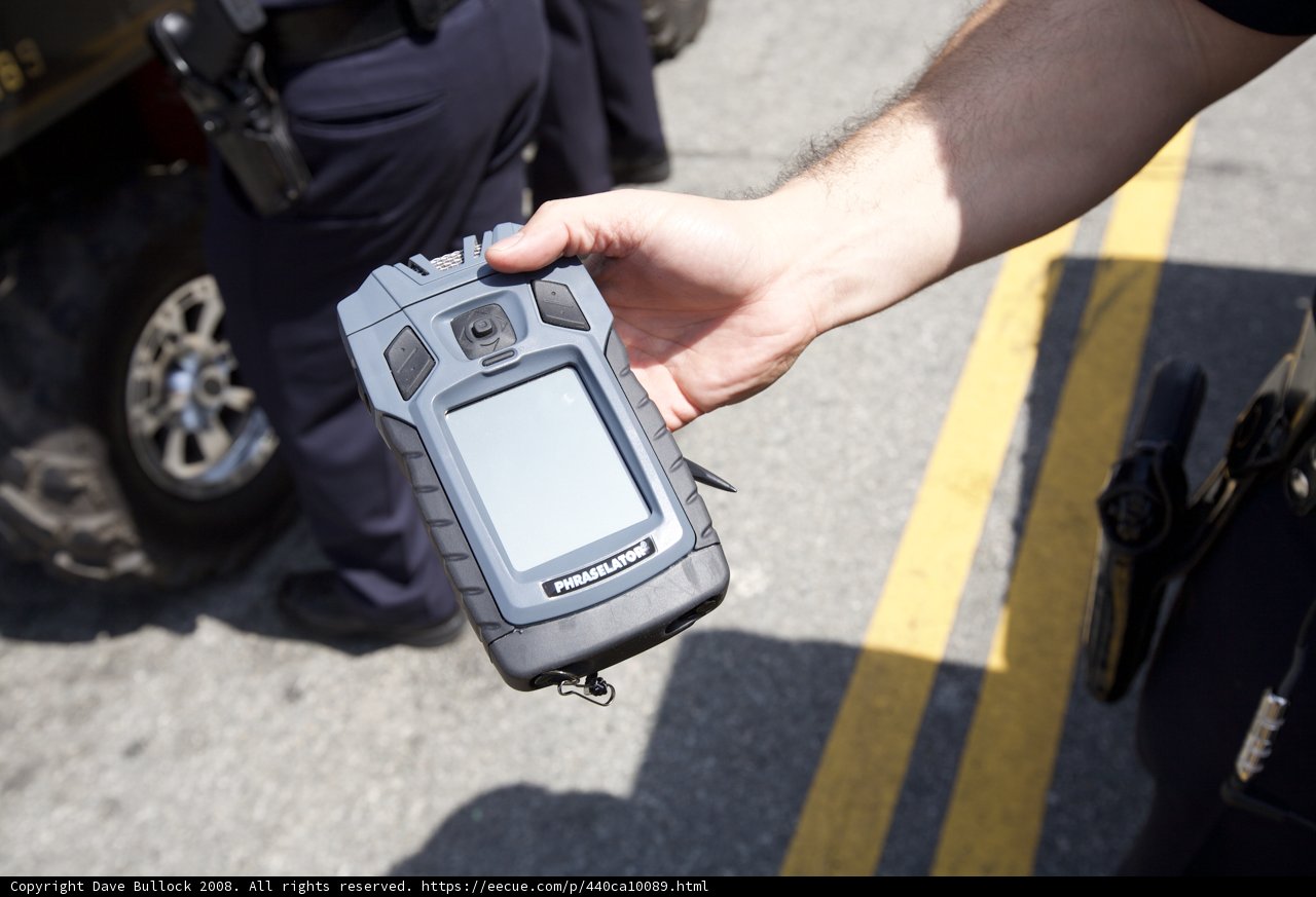Cell Phone and Police Car at 2008 May Day Rally