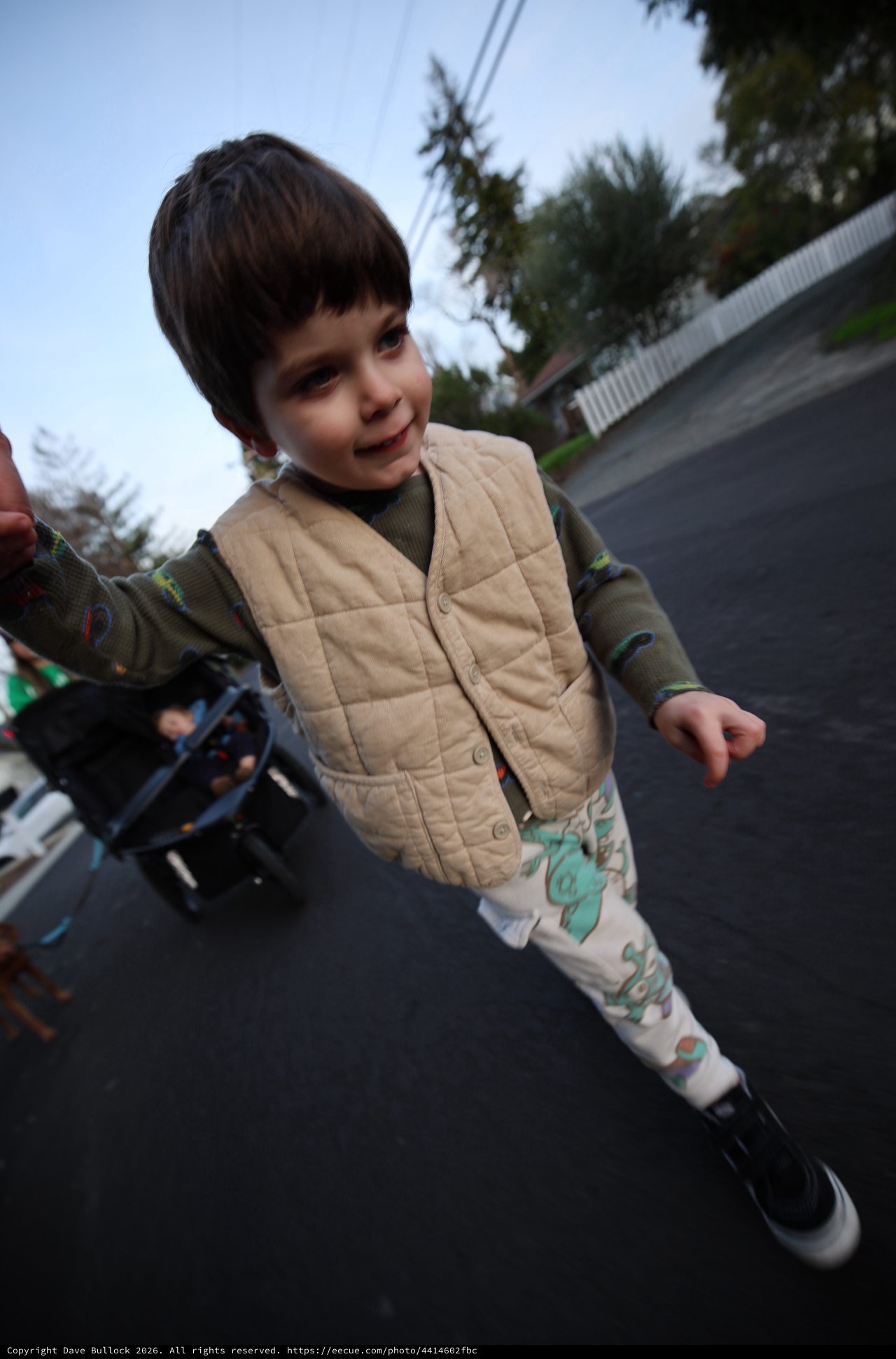 Young Child's Joyful Moment on Residential Street