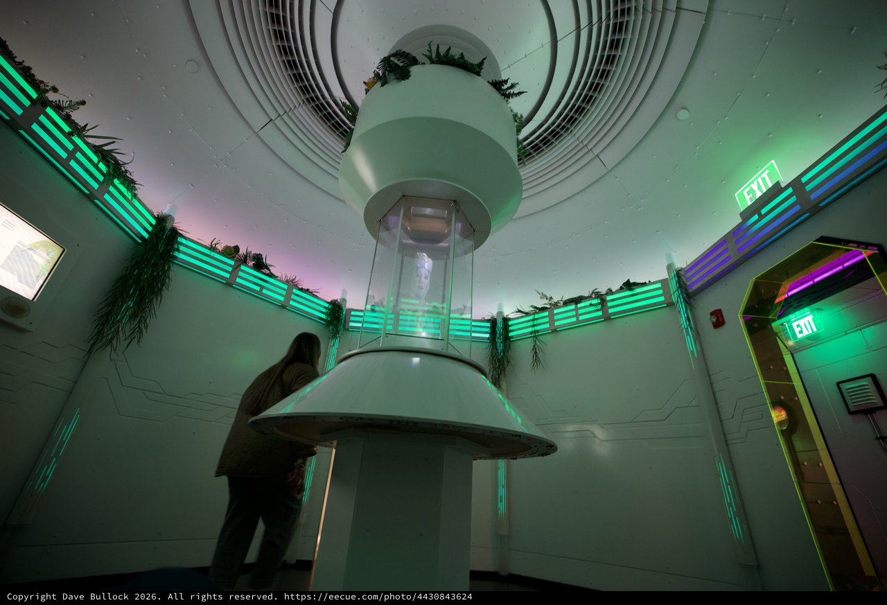 Futuristic Museum Interior with Cylindrical Light Installation