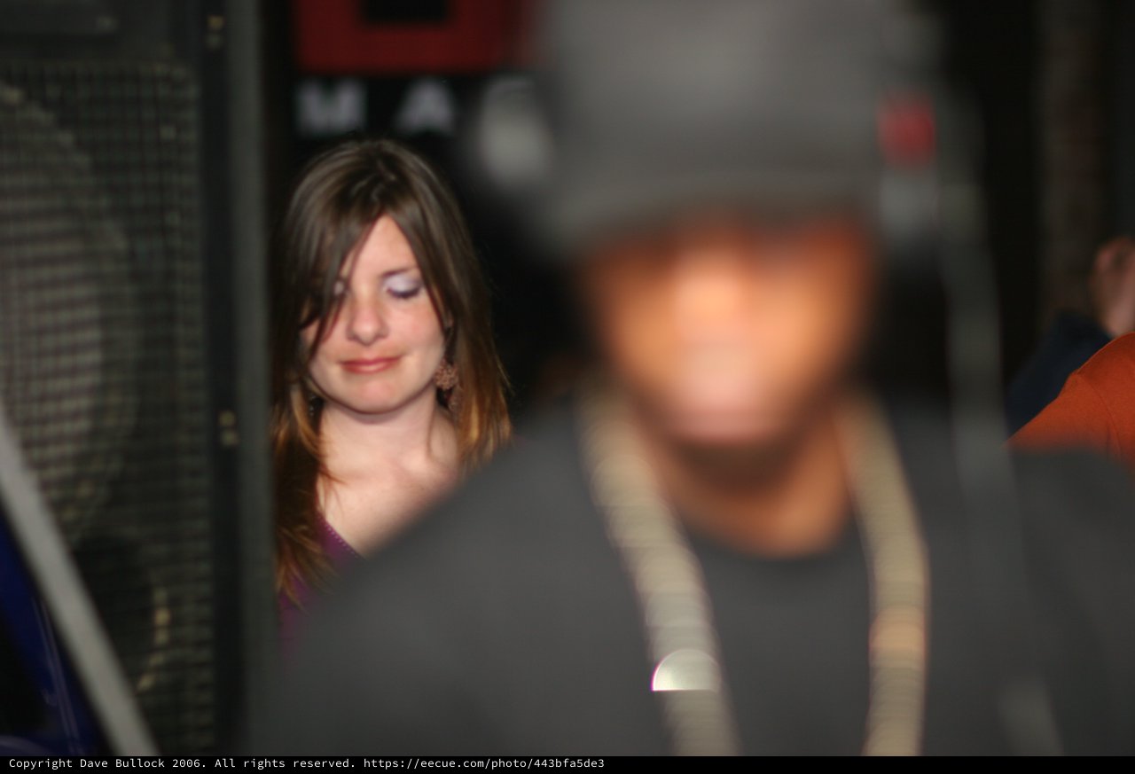 Smiling Woman at Nightclub Event in 2006