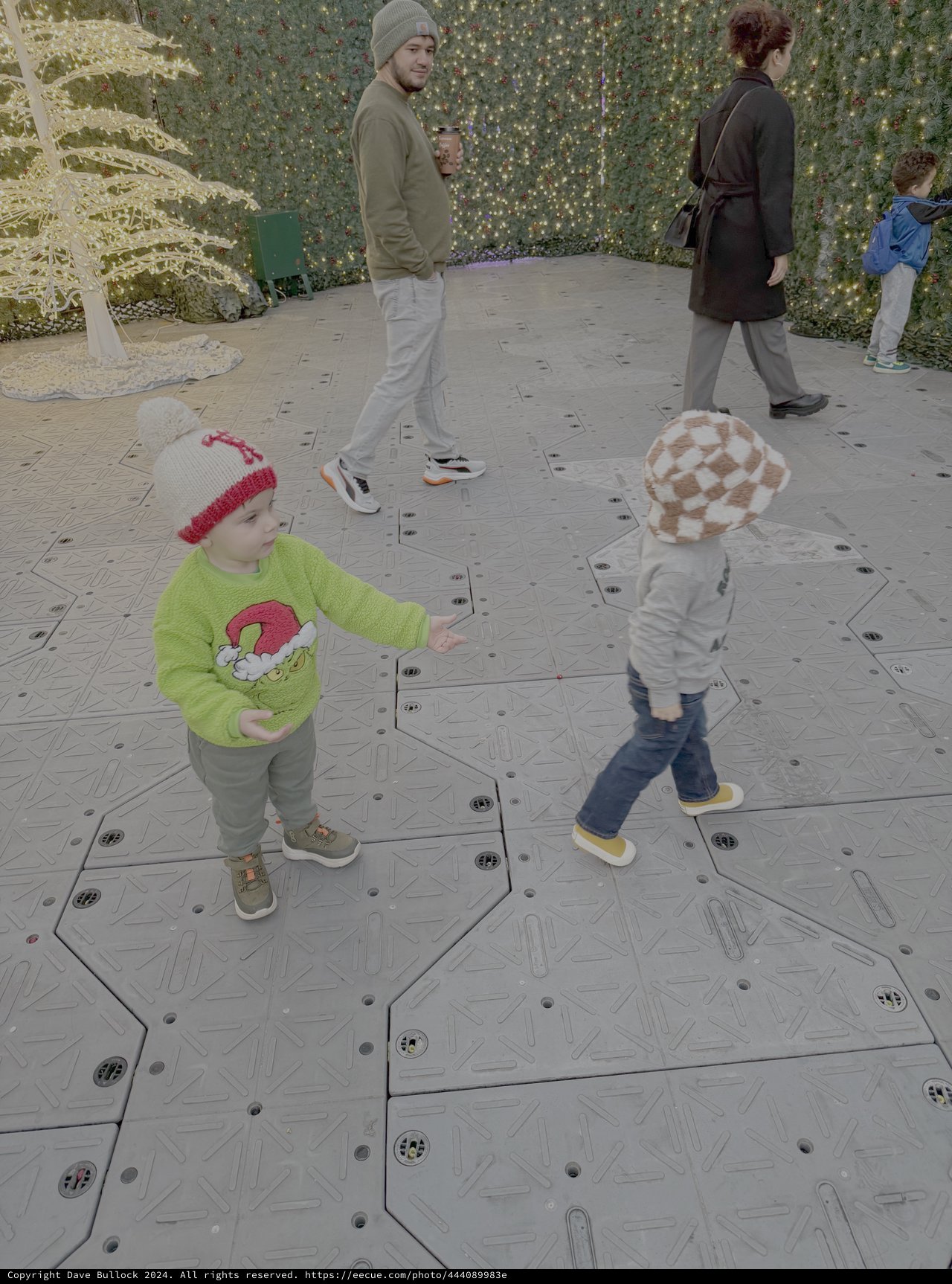 Family Explores Interactive Christmas Light Display