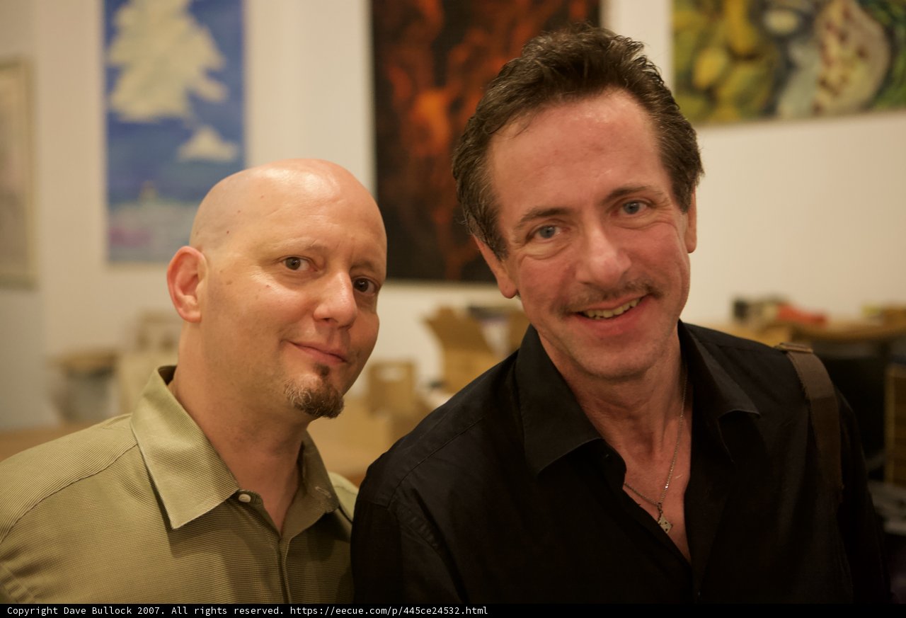 Two Men Clad in Dress Shirts Strike a Pose in Art Walk
