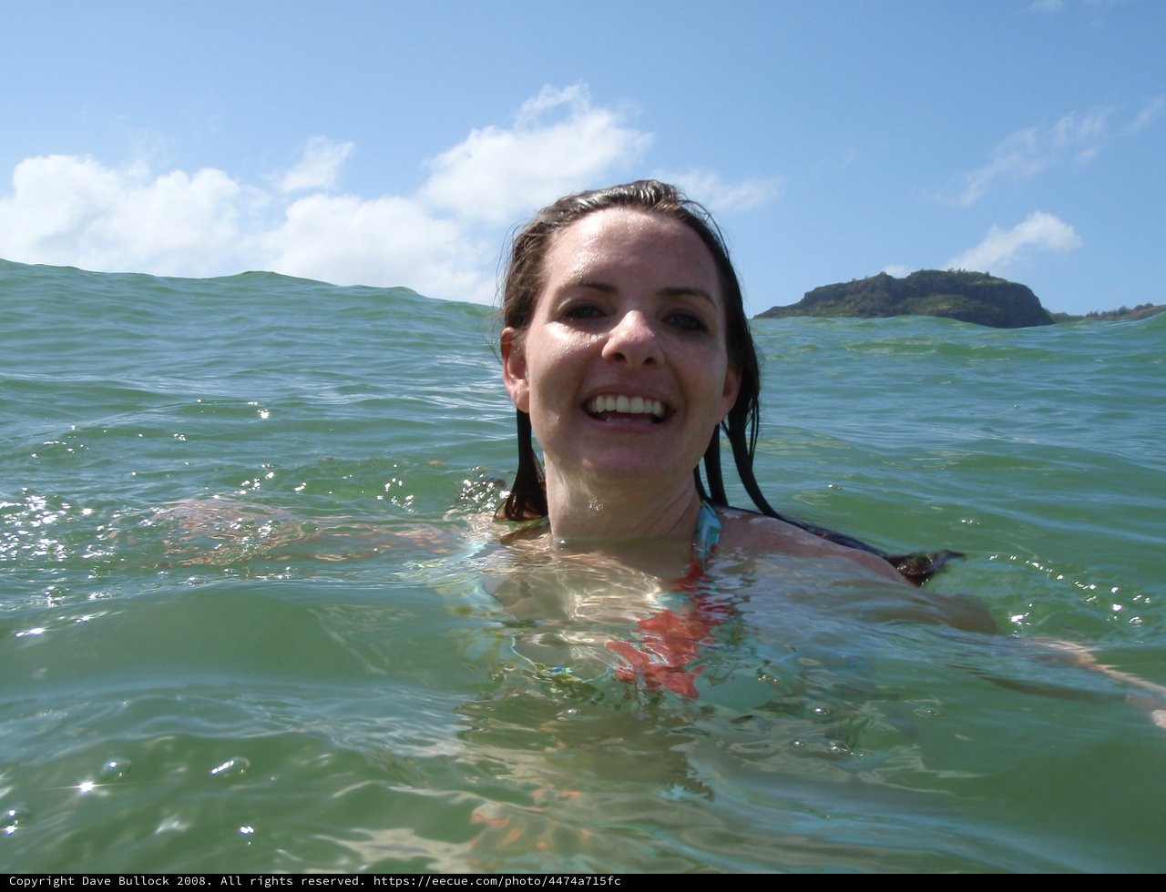 Smiling Woman Swimming in Hawaiian Ocean Waters