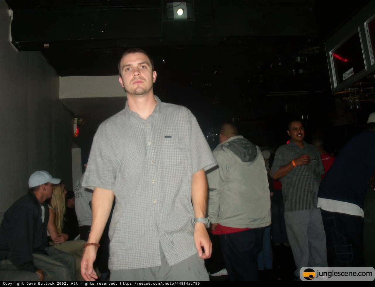 Man in a Crowded Urban Nightclub