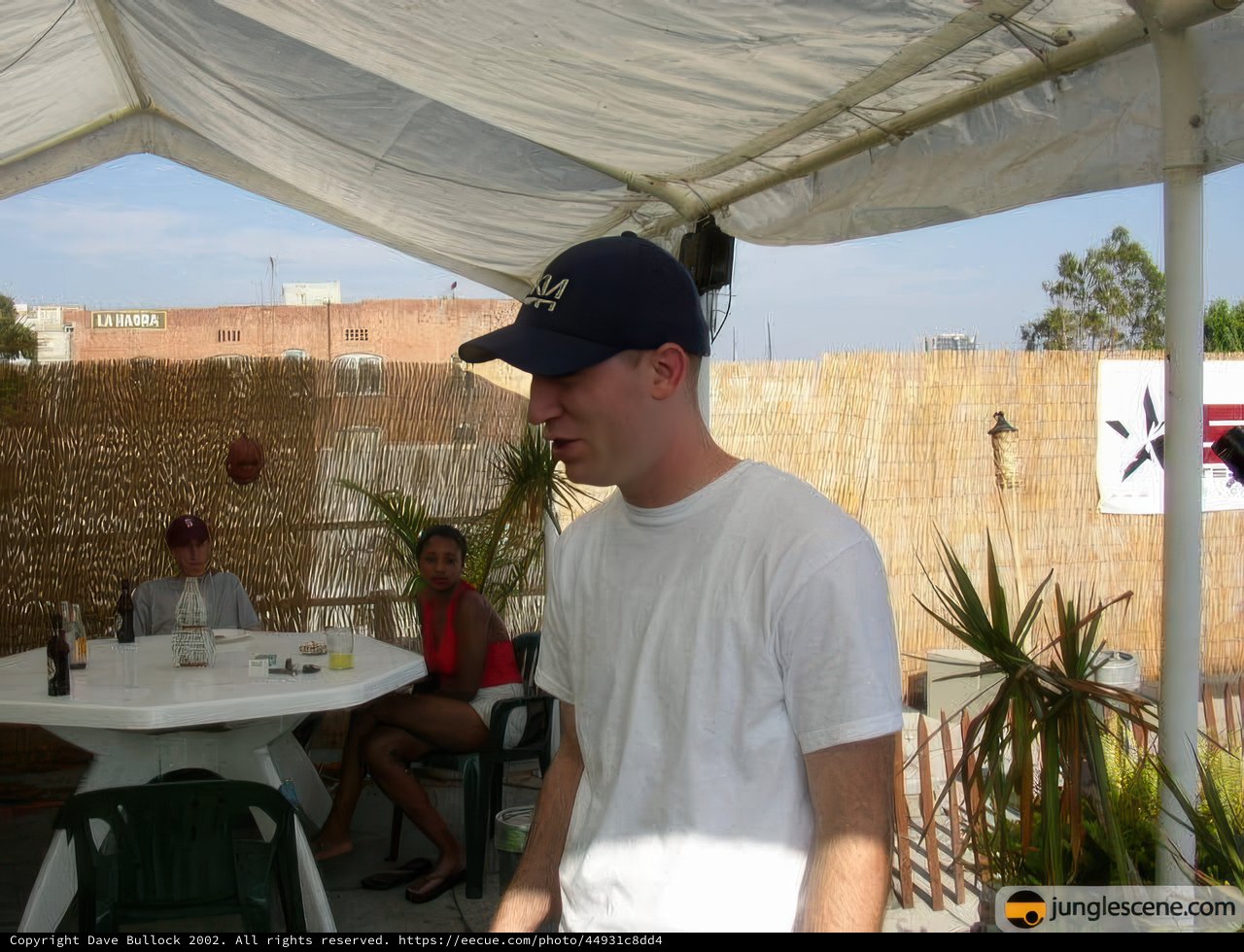 Man in Blue Baseball Hat