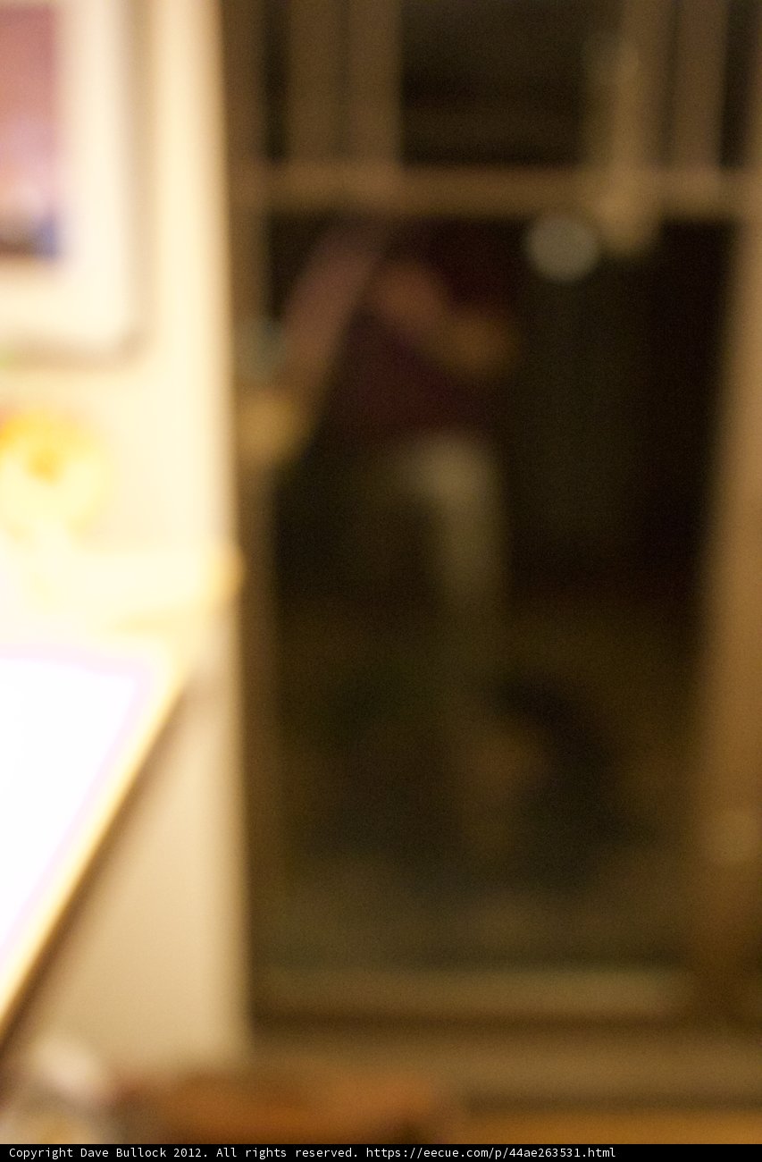 Blurry Figure in Front of a Door