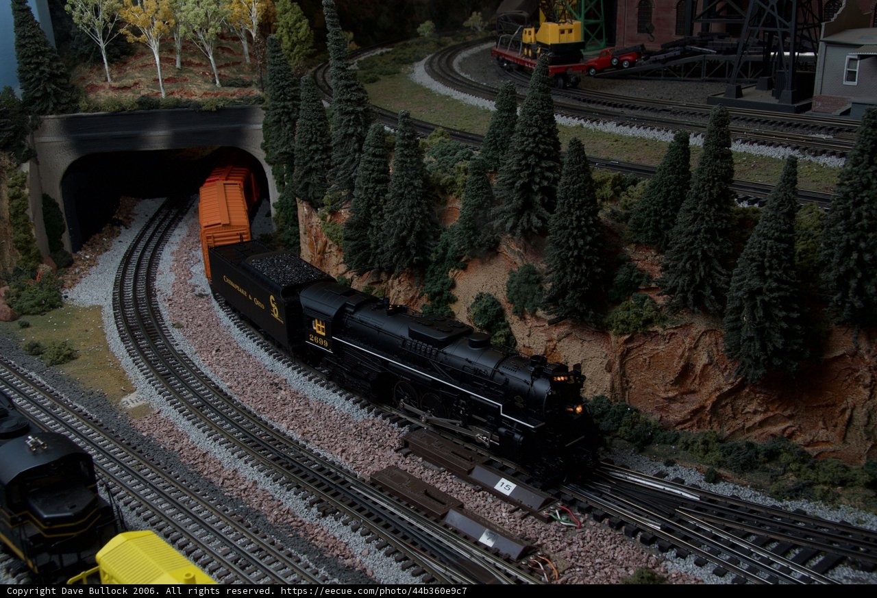 Toy Train Chugging Through the Trees