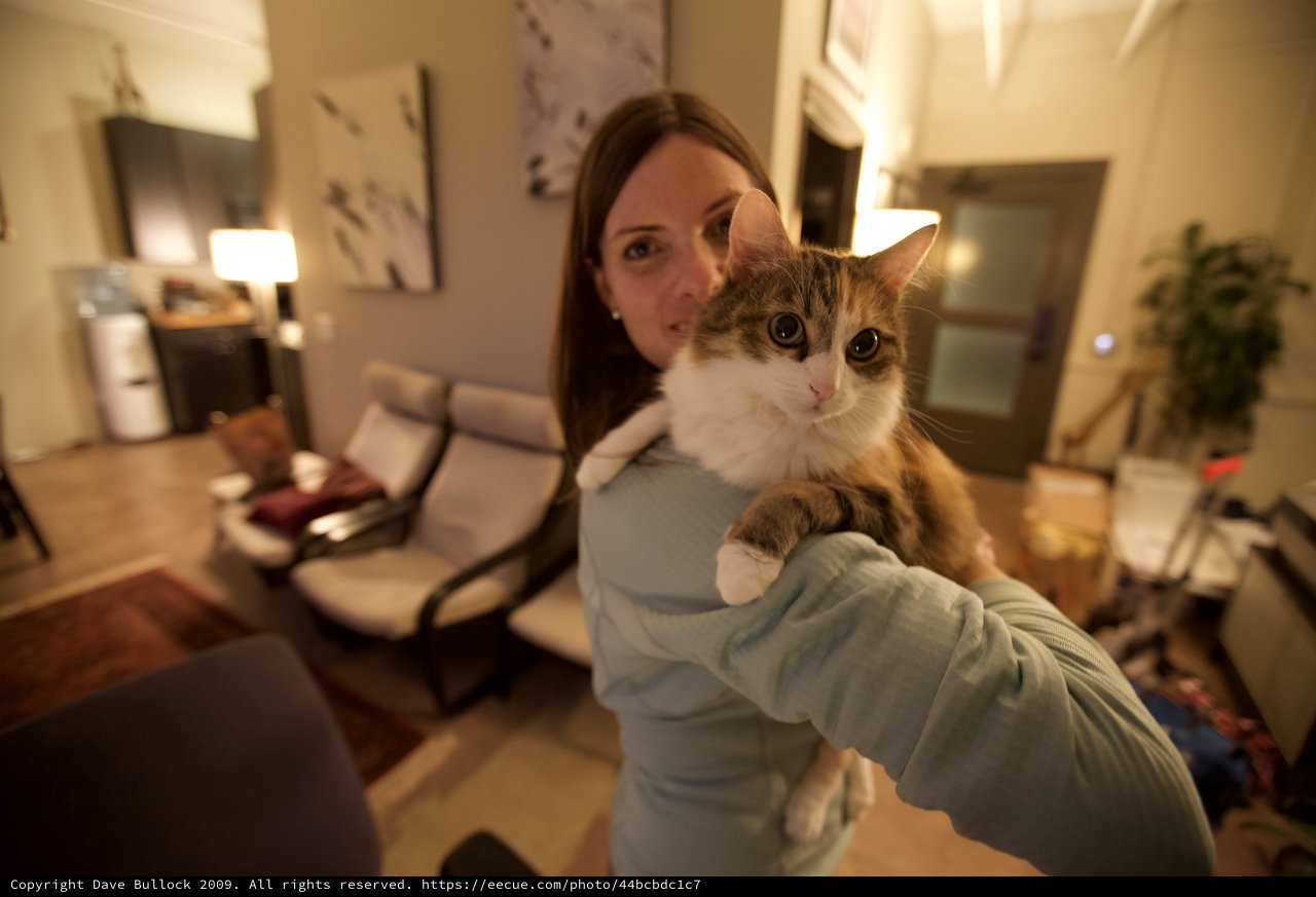 Woman Proudly Presents Fluffy Cat to Camera