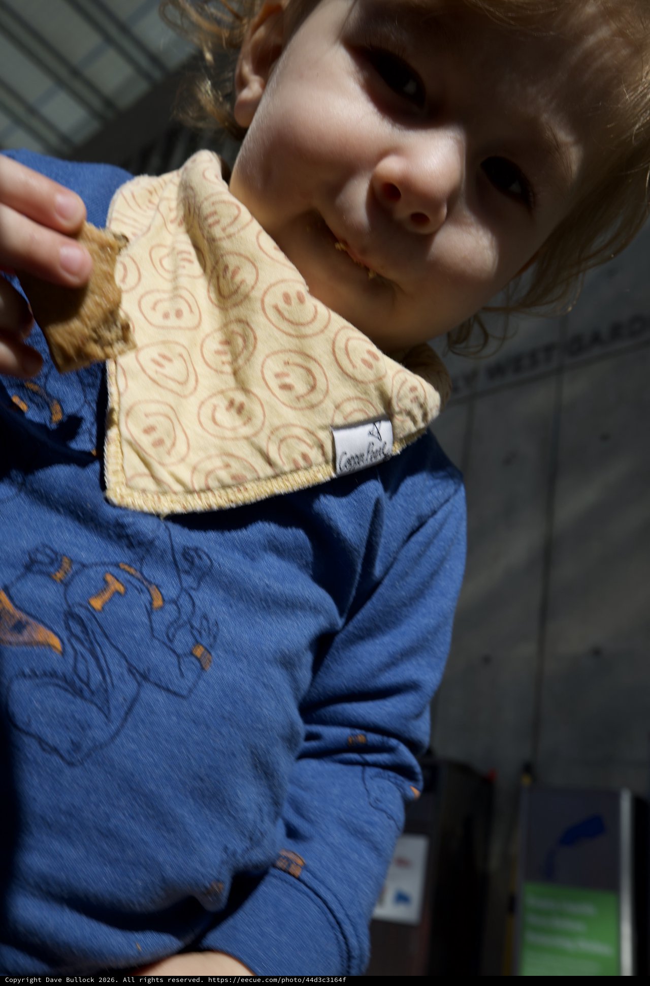 Child Proudly Displays Handmade Smiley Face Cloth