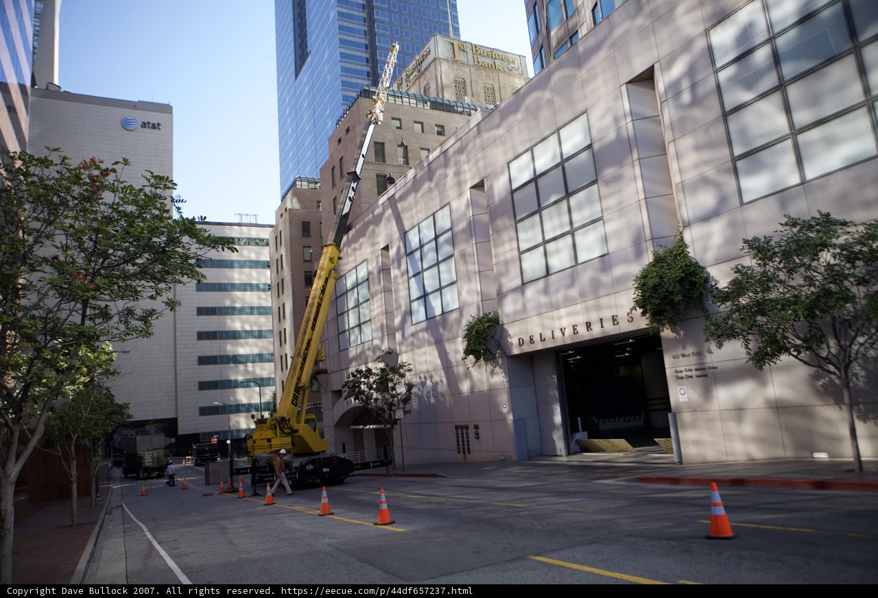 Crane in front of High-Rise Office Building