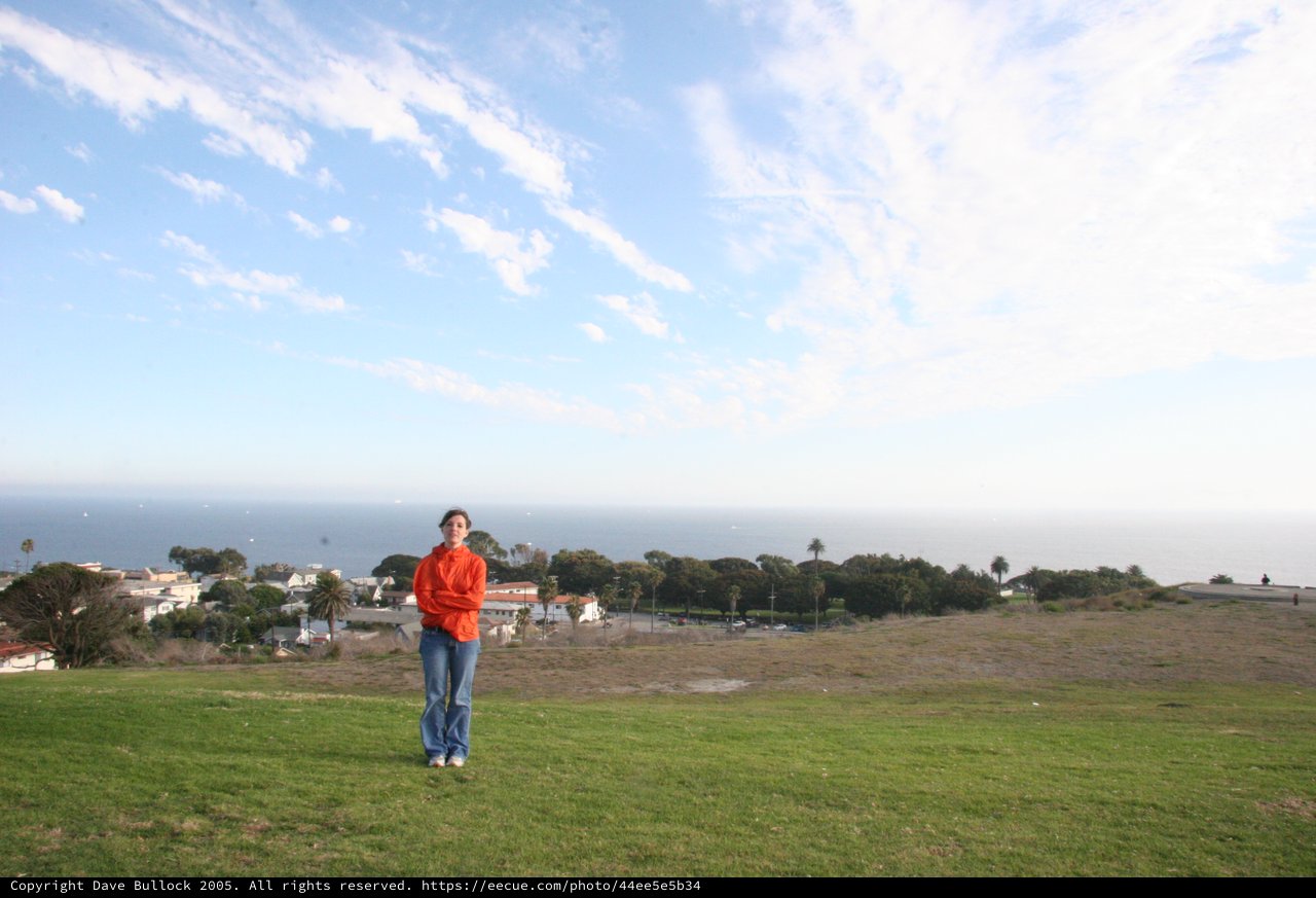 Woman in Red Jacket Overlooking Coastal California Town