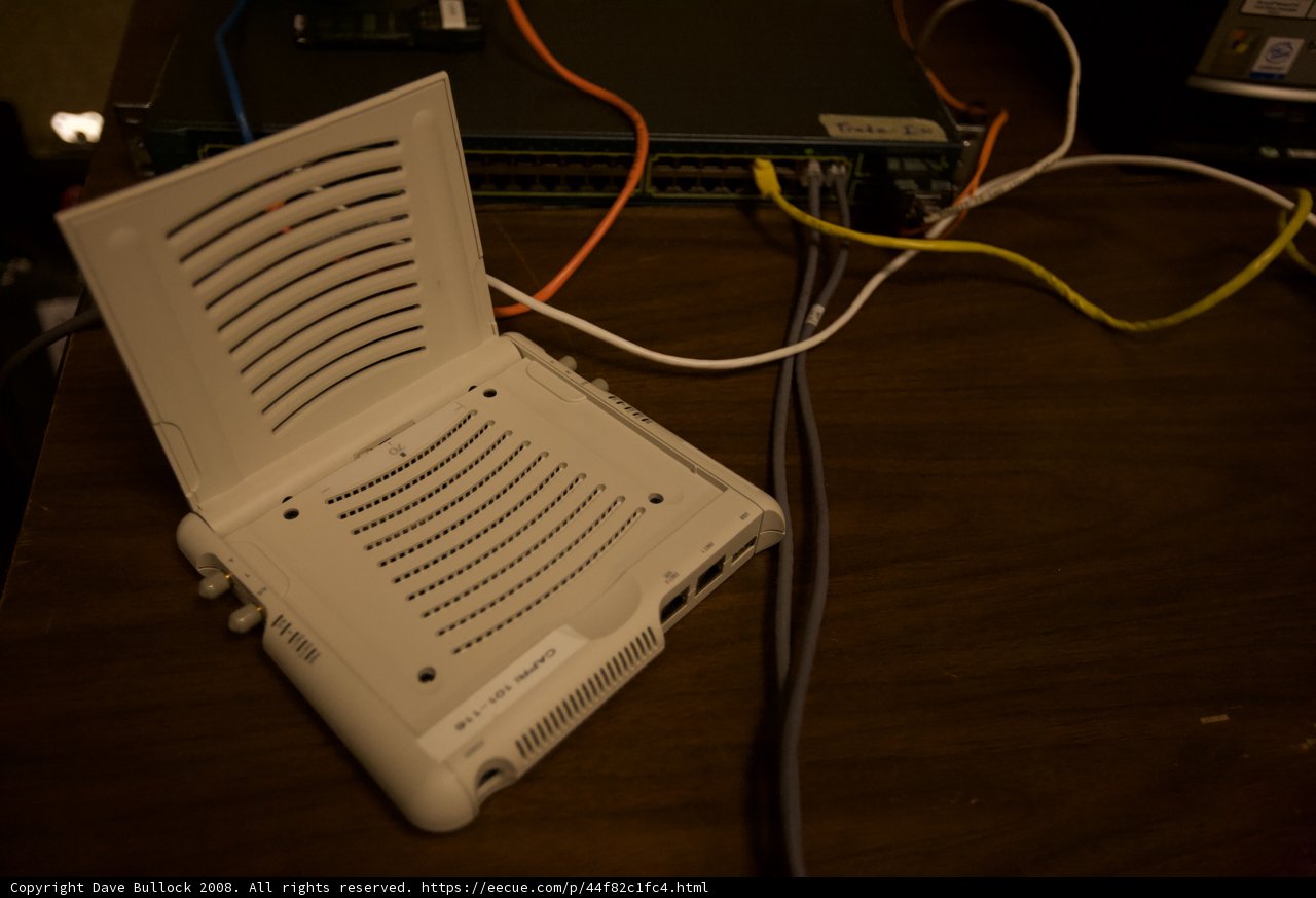 White Computer Connected to a Tangle of Wires