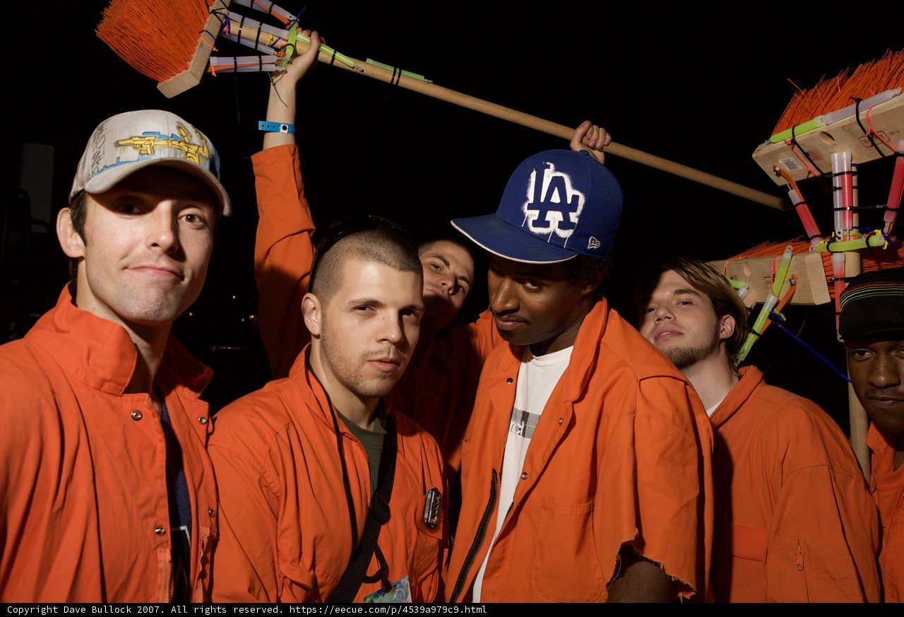 Orange-clad Group Under the Night Sky