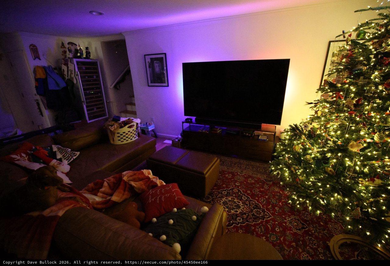 Cozy Christmas Living Room with Illuminated Tree and Ambient Lighting