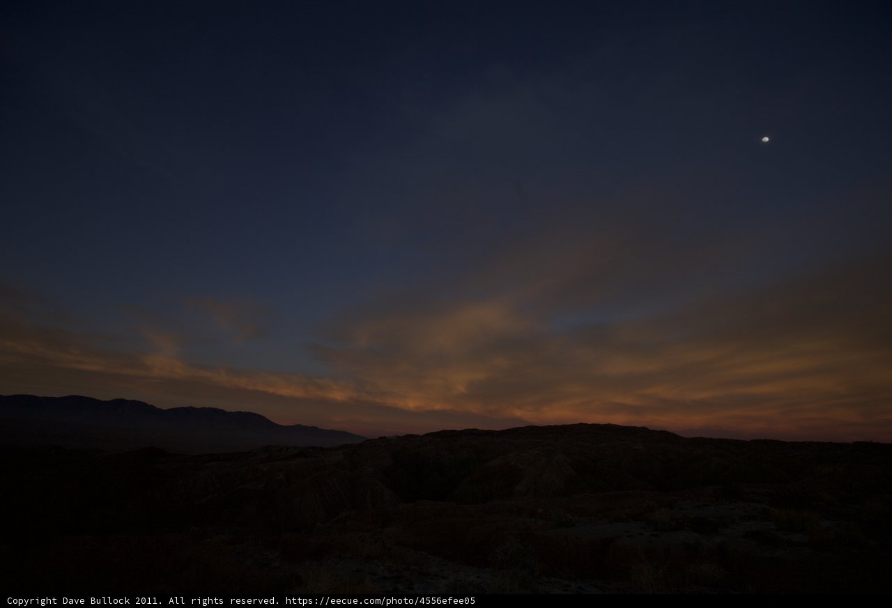 Desert Sunset with Moon and Sun