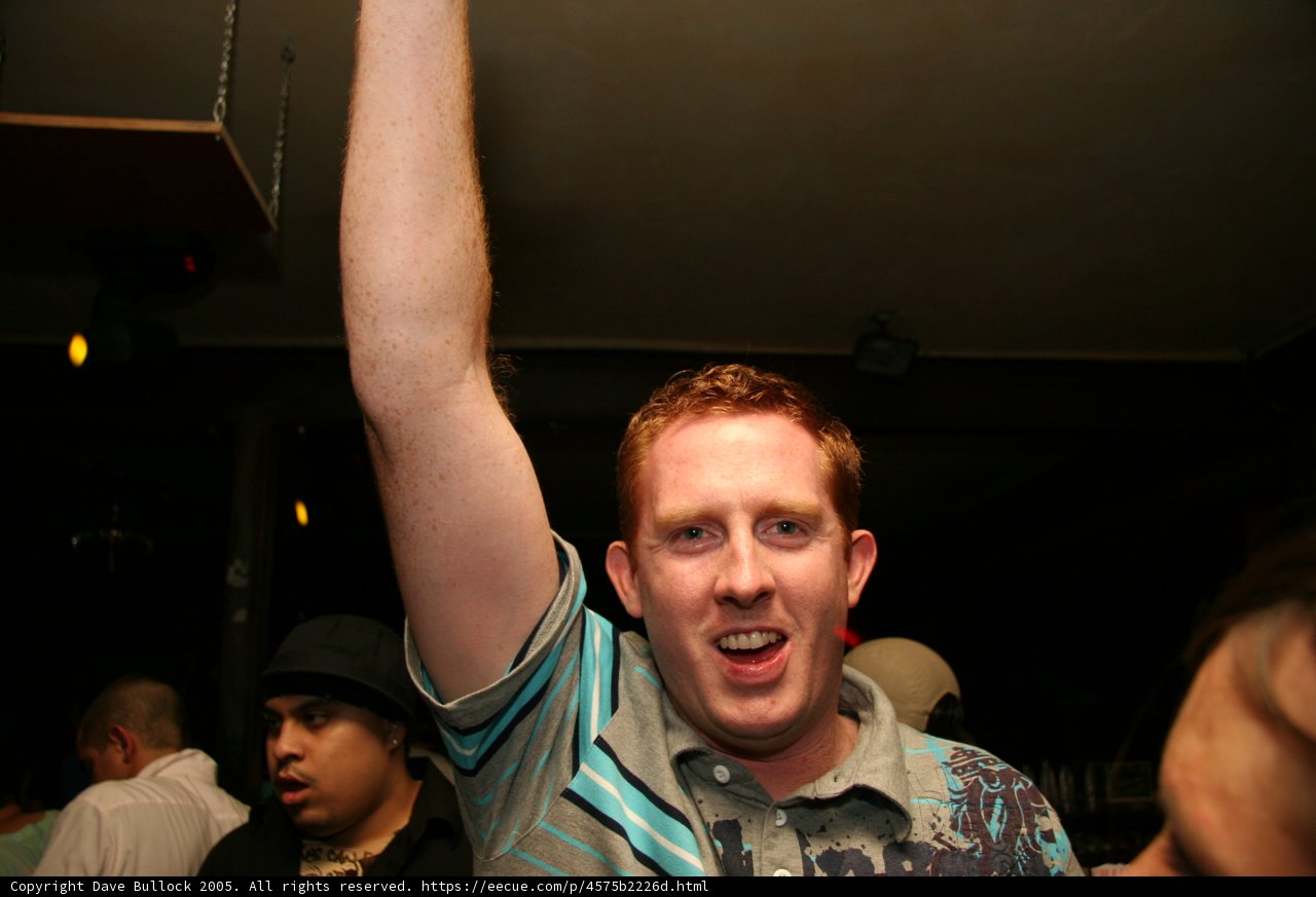 Blue Shirted Man in the Night Club