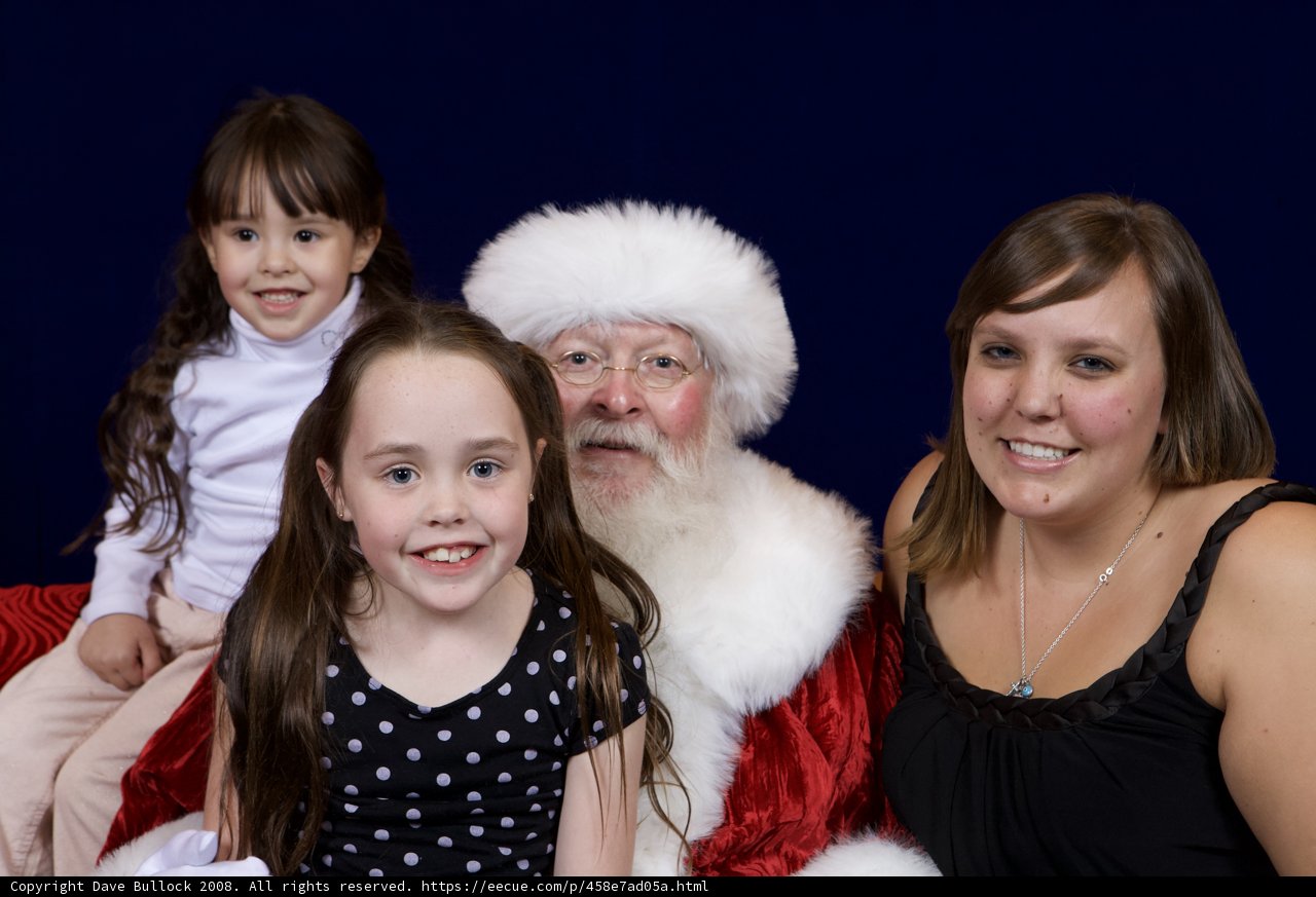 Santa Claus and Family Pose on Couch