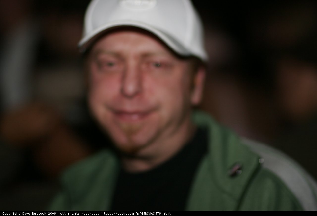 Blurry Man in White Cap
